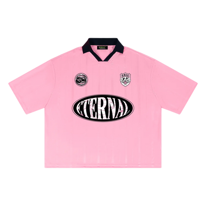 Pink shirt with 'Eterna' logo on a white background
