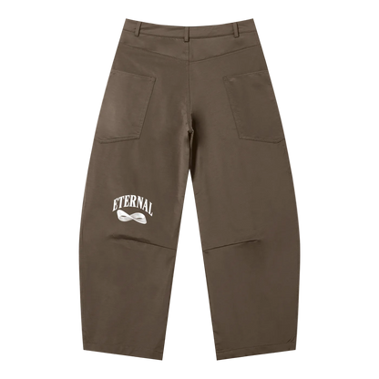 Brown pants with 'Eternal' logo on a white background
