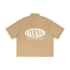 Beige shirt with 'Eternal Abstract Research Technology' logo on the back against a white background