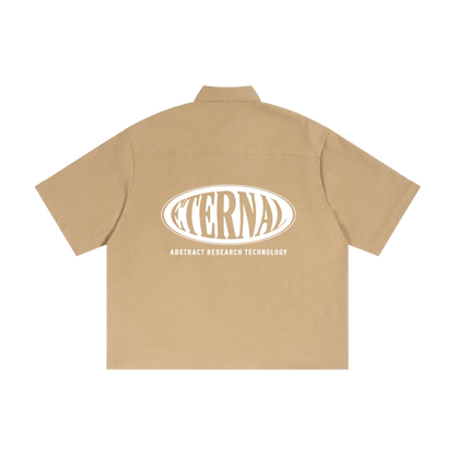 Beige shirt with 'Eternal Abstract Research Technology' logo on the back against a white background